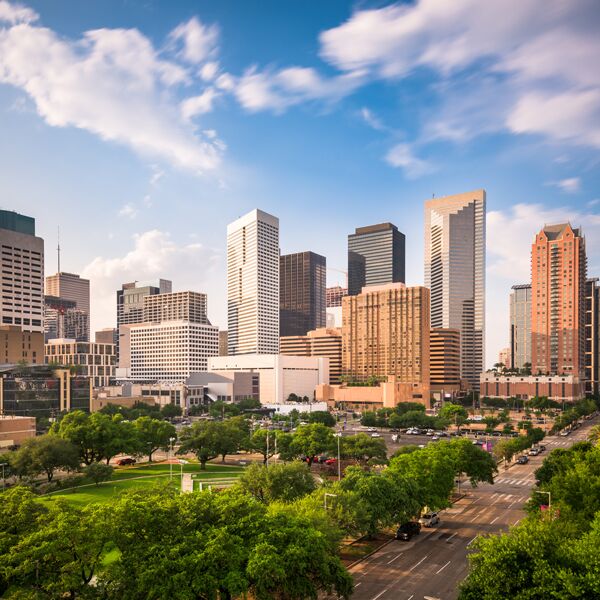 Downtown Houston skyline above a green park